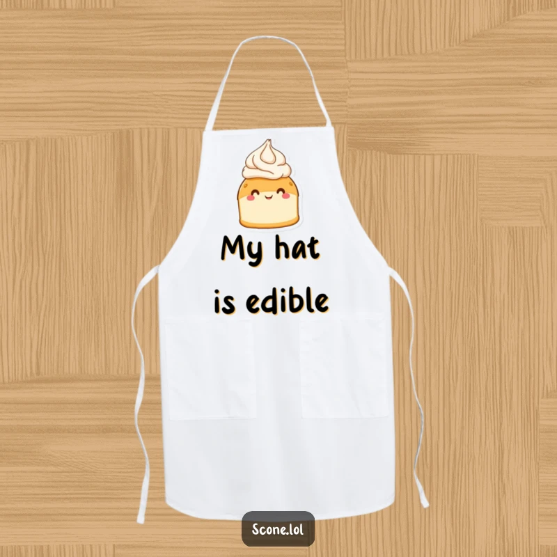 Funny scone wearing a cream hat, beaming with happiness, featured on a kitchen apron for baking fun.