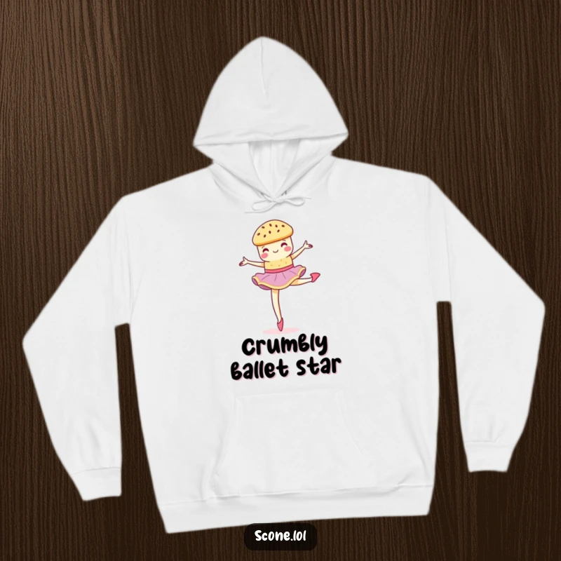Funny scone performing a graceful, crumbly pirouette on a cozy hoodie, perfect for dancers and comfort.