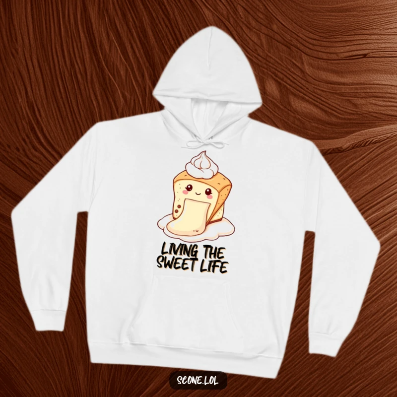 Funny scone hoodie featuring a scone gleefully sliding down a dollop of cream like a slide, offering warmth and humor as a funny gift.